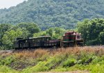 EBT m-7 and the excursion train northbound on the long fill.